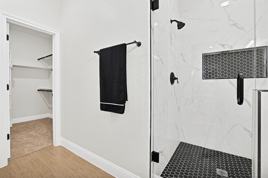 Bathroom with a shower with shower door