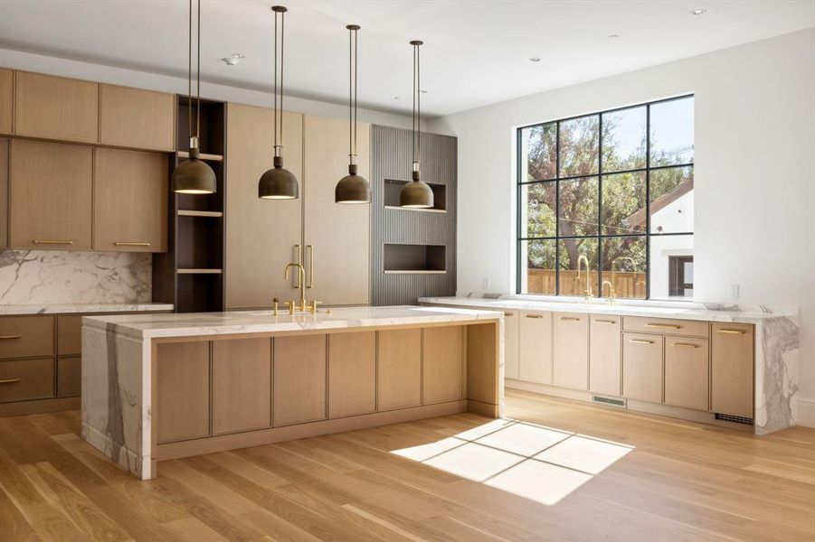 Kitchen with Wood Mode cabinetry and Calcutta Marble