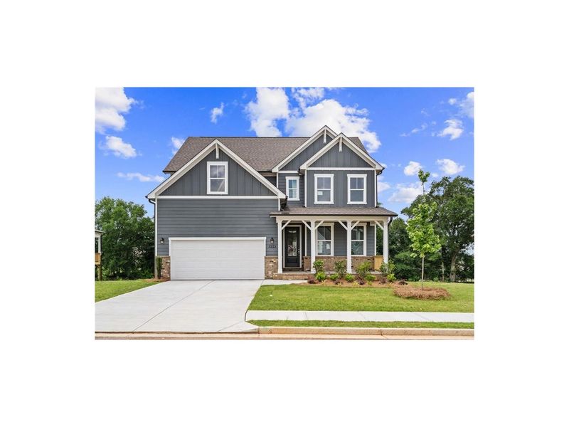 Front exterior of a new home in Wehunt Meadows, Hoschton, GA, highlighting curb appeal (Image 1).