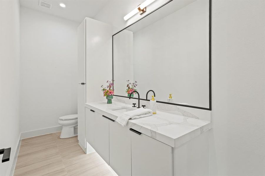 Bathroom with toilet and vanity