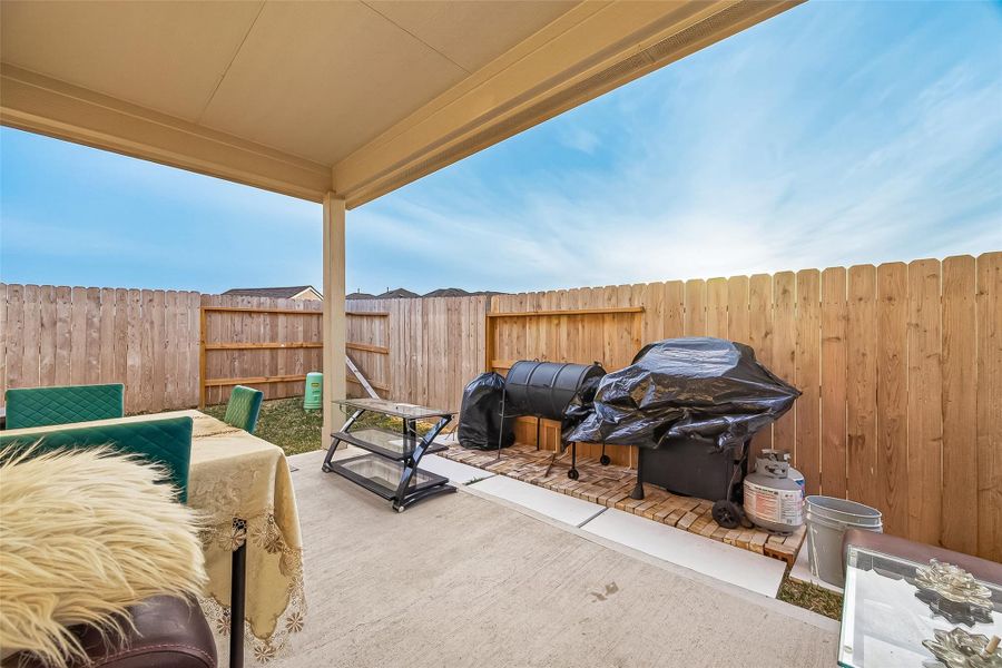The covered patio is built for weekend BBQs and morning coffee, providing a shaded sanctuary regardless of the weather.