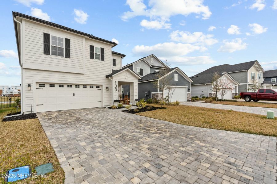 Front exterior of a new home in Silver Landing at SilverLeaf, St. Augustine, FL, highlighting curb appeal (Image 22).