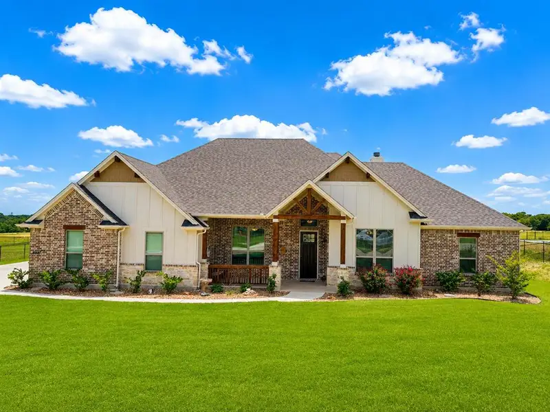 Front exterior of a new home in , Waxahachie, TX, highlighting curb appeal (Image 22).
