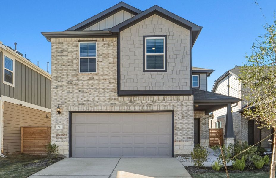 Front exterior of a new home in Horizon Lake, Leander, TX, highlighting curb appeal (Image 16).