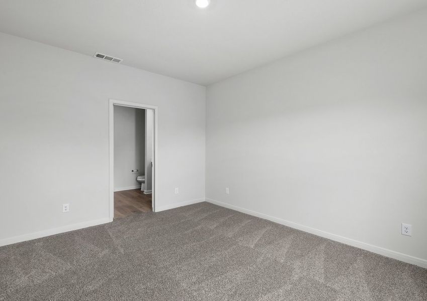 The master suite has a large bedroom, ensuite bathroom and a walk-in closet.