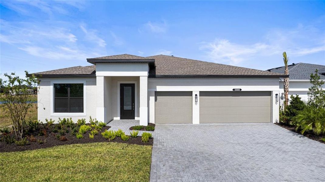 Front exterior of a new home in Woodland Preserve, Parrish, FL, highlighting curb appeal (Image 19).