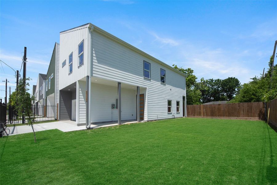 A large backyard offers plenty of space for BBQs, play, and outdoor entertaining. A large backyard offers plenty of space for BBQs, play, and outdoor entertaining.
