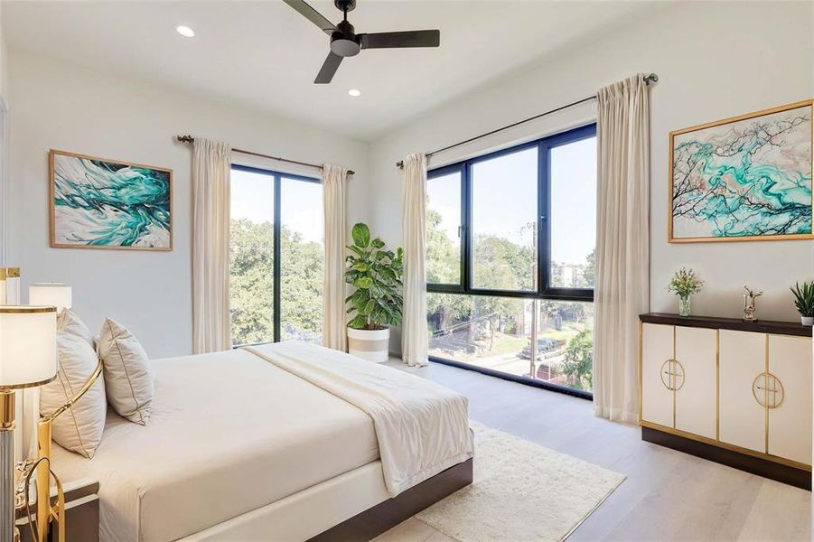 Bedroom featuring ceiling fan and light wood-type flooring