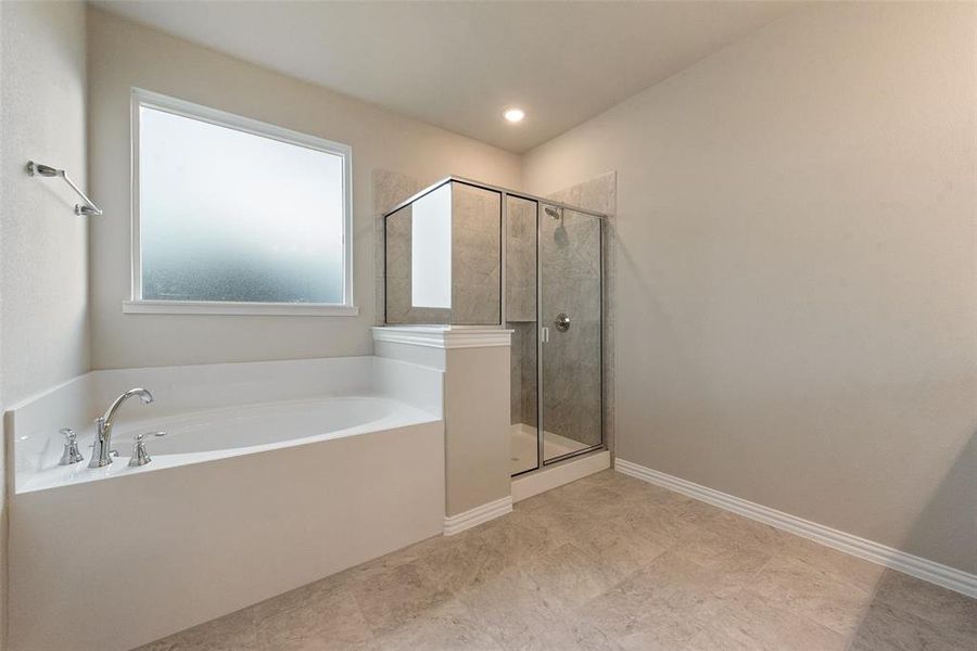 Full bath with a garden tub and a shower stall