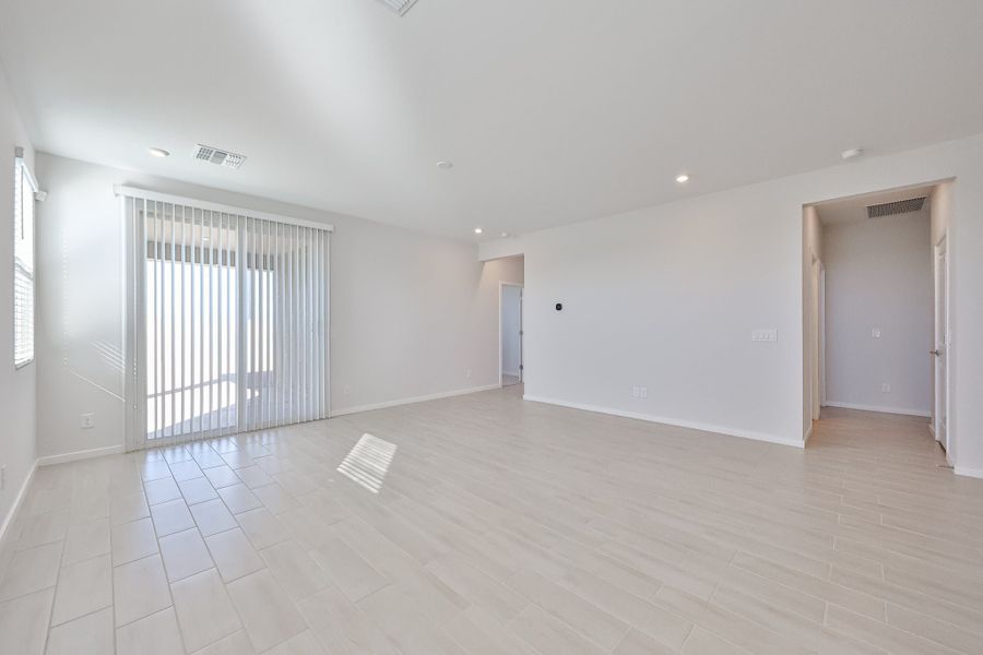 A room with white walls and a wood floor. A room with white walls and a wood floor.