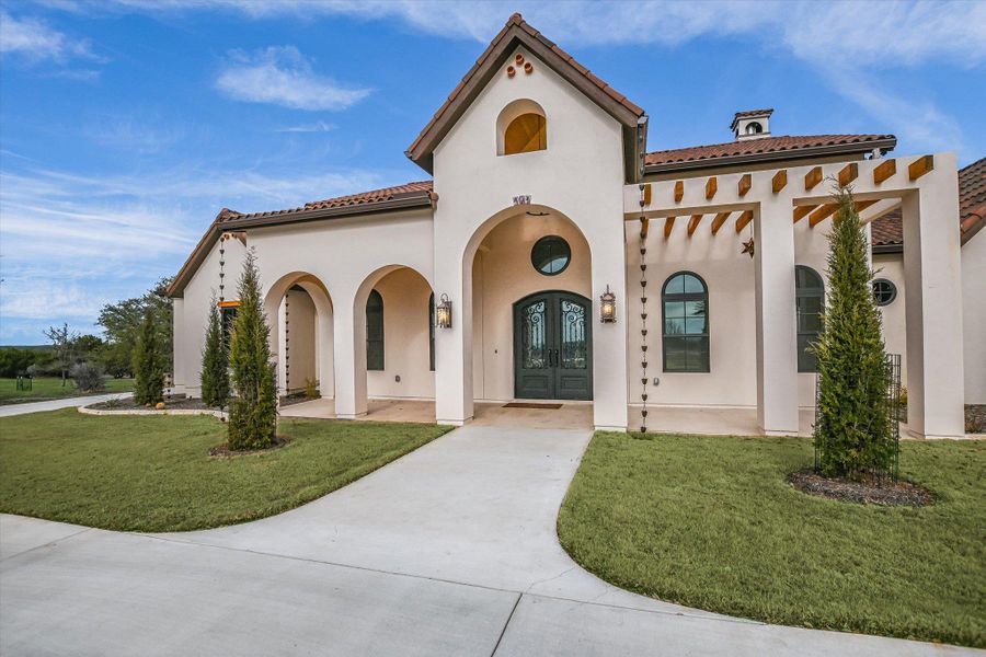 Front exterior of a new home in , Burnet, TX, highlighting curb appeal (Image 1). Front exterior of a new home in , Burnet, TX, highlighting curb appeal (Image 1).