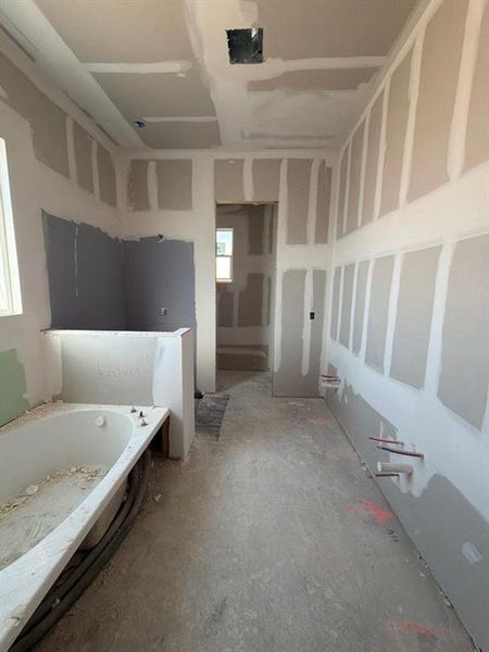 Full bathroom featuring a bath