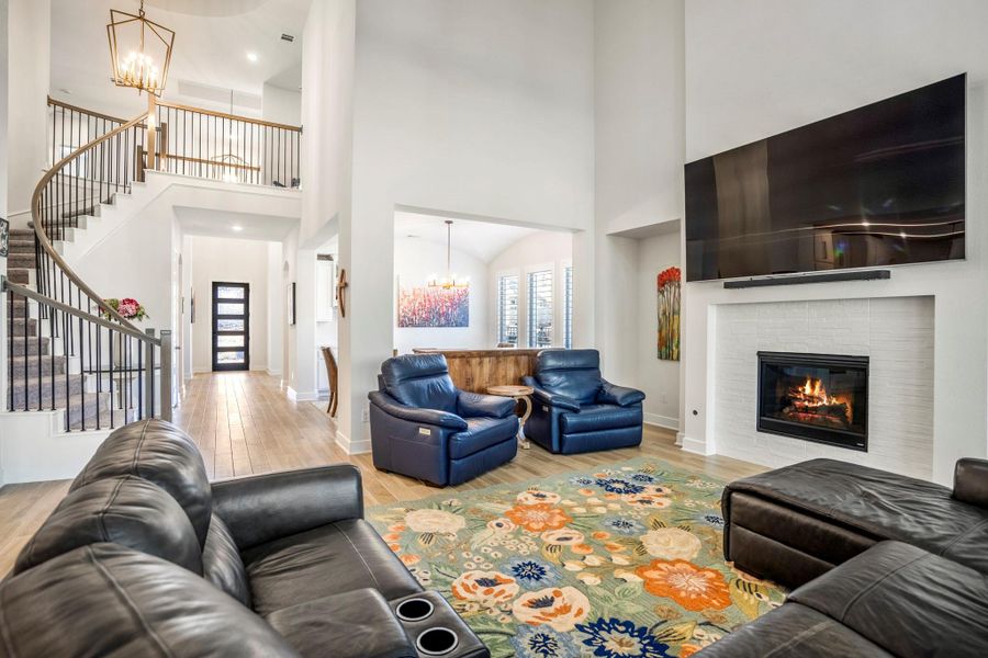 A curved staircase and open entry way add elegance and sophistication.