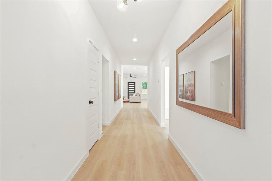 Hallway featuring recessed lighting and light wood-type flooring