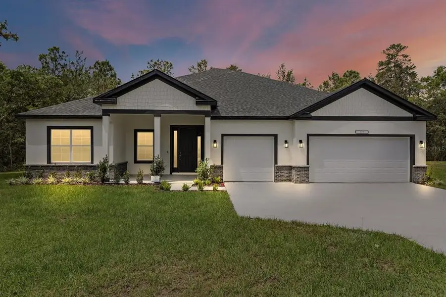 Front exterior of a new home in , Ocala, FL, highlighting curb appeal (Image 1).