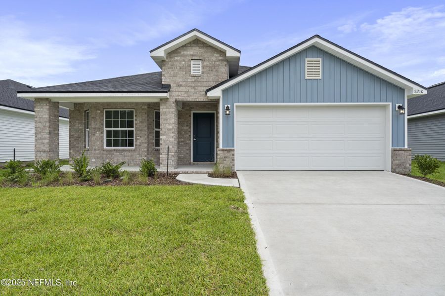 Front exterior of a new home in Summerglen, Jacksonville, FL, highlighting curb appeal (Image 12).