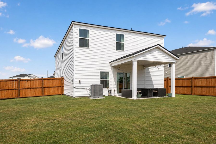 Exterior details and patio area of a home in Lindera Preserve at Cane Bay Plantation, Summerville (Image 29).