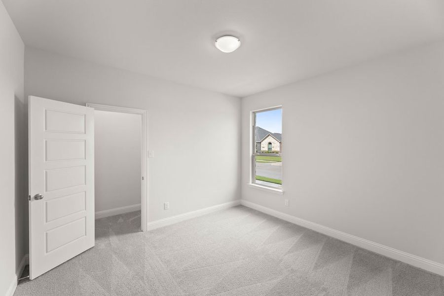 Representative exterior photo of a completed home built from the Winchester by Impression Homes in Timberbrook, Justin, TX (Image 18).