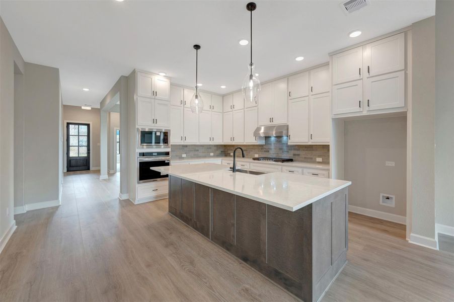 Furnished interior view inside a new home in COLTON - Reserve Collection, Todd Mission (Image 11).