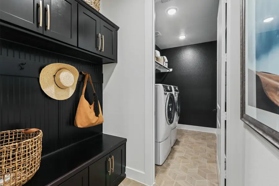 ** REPRESENTATION PHOTO OF THE SAME FLOOR PLAN, FINISHES WILL VARY**Convenient built-in storage off the mud room is a great space to hang back packs and purses!