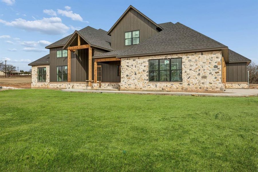Front exterior of a new home in RangeWood, Weatherford, TX, highlighting curb appeal (Image 2). Front exterior of a new home in RangeWood, Weatherford, TX, highlighting curb appeal (Image 2).