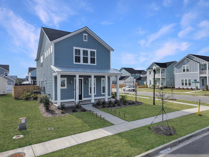 Front exterior of a new home in Carnes Crossroads, Summerville, SC, highlighting curb appeal (Image 23).