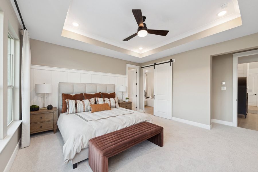 Primary suite with decorative feature wall Primary suite with decorative feature wall