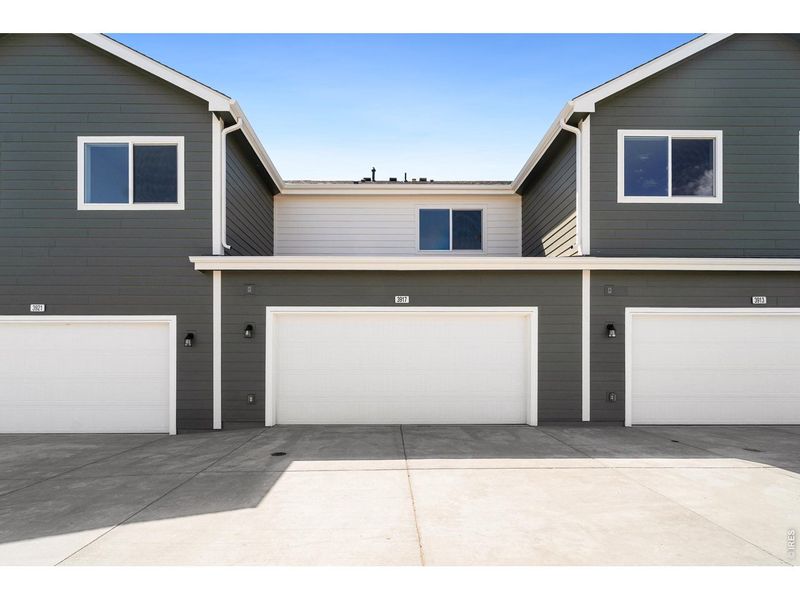 Front exterior of a new home in Liberty Draw, Evans, CO, highlighting curb appeal (Image 1). Front exterior of a new home in Liberty Draw, Evans, CO, highlighting curb appeal (Image 1).