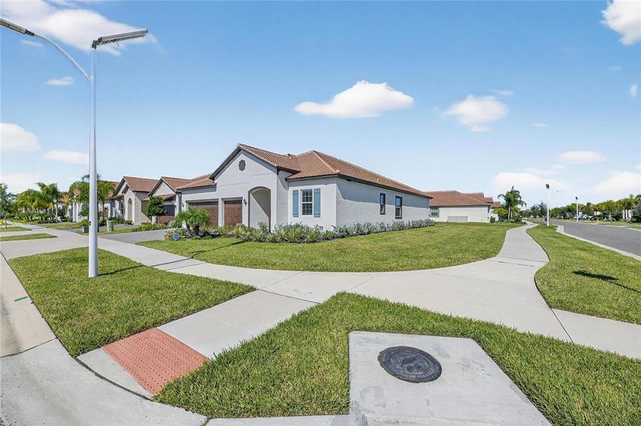 Front exterior of a new home in , Wimauma, FL, highlighting curb appeal (Image 31).