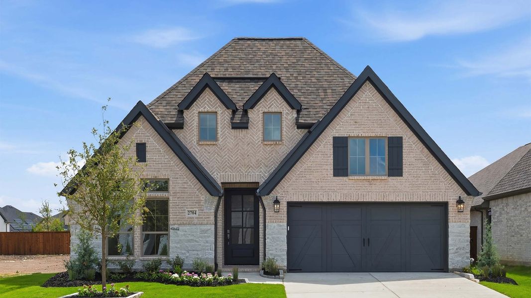 Front exterior of a new home in Cambridge Crossing, Celina, TX, highlighting curb appeal (Image 1). Front exterior of a new home in Cambridge Crossing, Celina, TX, highlighting curb appeal (Image 1).