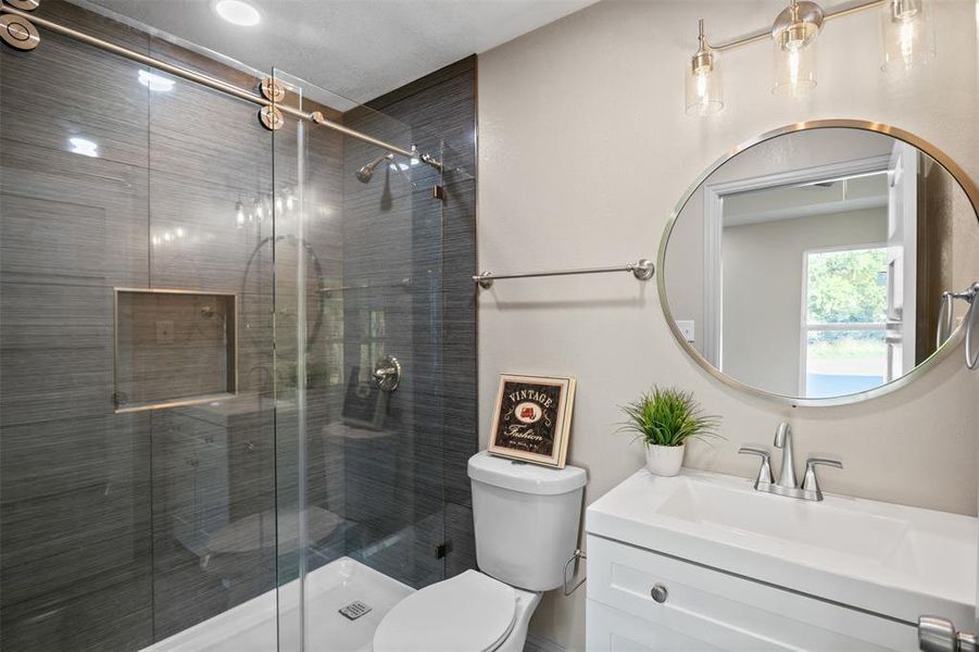 Full bath featuring vanity and a stall shower