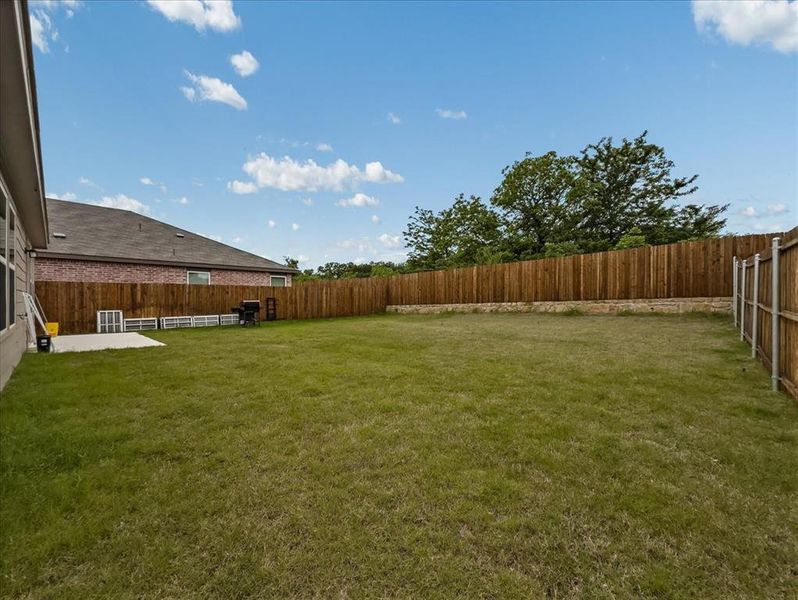 Exterior details and patio area of a home in Townsend Green, Denton (Image 3).