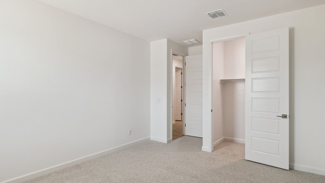 Spacious, unfurnished interior of a new home in Zanjero Pass, Waddell (Image 41).