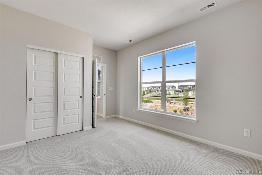 Spacious, unfurnished interior of a new home in Crescendo at The Aurora Highlands, Aurora (Image 27).