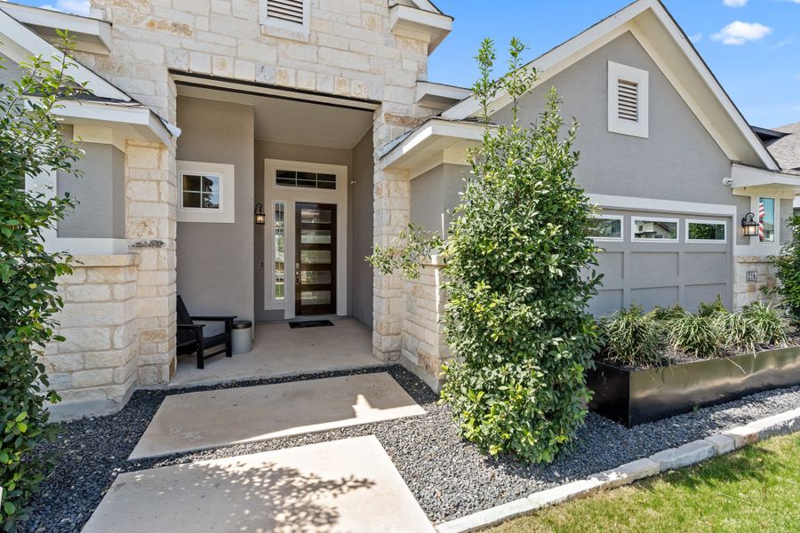 Front exterior of a new home in Esperanza – New Phase Now Selling, Boerne, TX, highlighting curb appeal (Image 21). Front exterior of a new home in Esperanza – New Phase Now Selling, Boerne, TX, highlighting curb appeal (Image 21).