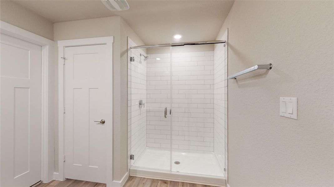 A well-lit, contemporary shower with subway tile surrounds and a sleek glass enclosure offers a refreshing start to your day. A well-lit, contemporary shower with subway tile surrounds and a sleek glass enclosure offers a refreshing start to your day.