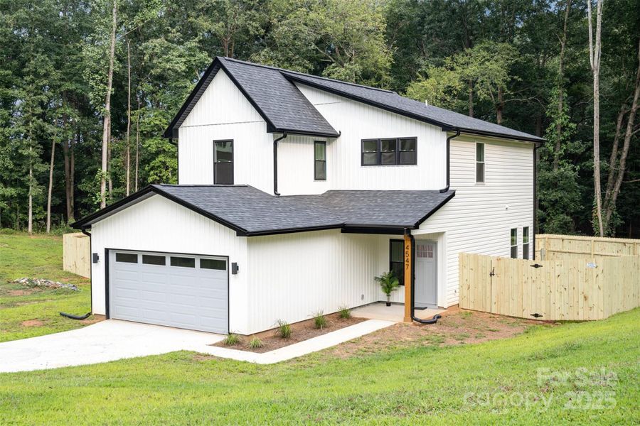 Front exterior of a new home in , Hickory, NC, highlighting curb appeal (Image 24).