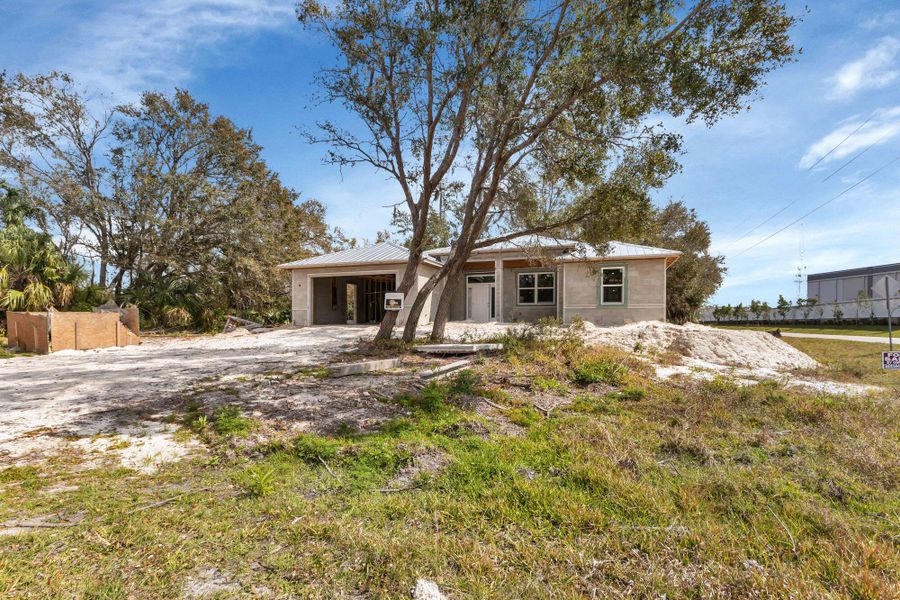 Front exterior of a new home in , Port Charlotte, FL, highlighting curb appeal (Image 7). Front exterior of a new home in , Port Charlotte, FL, highlighting curb appeal (Image 7).