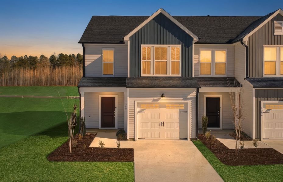 Front exterior of a new home in Poets Walk, Whitsett, NC, highlighting curb appeal (Image 29).