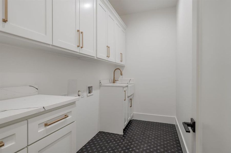 Laundry room with cabinet space and washer hookup Laundry room with cabinet space and washer hookup