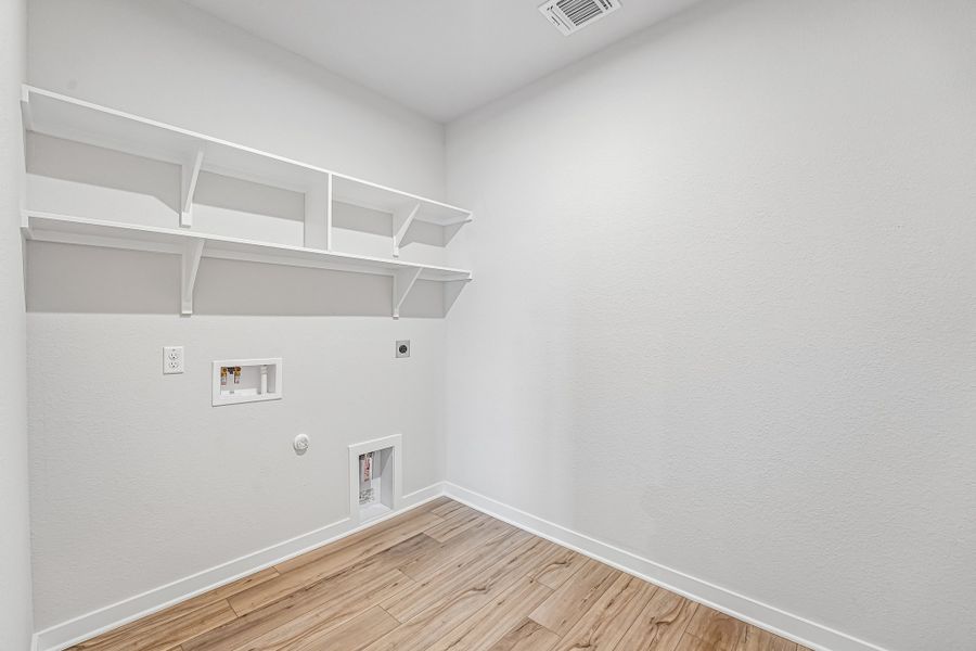 Representative unfurnished interior of a home built from the Warrior by Omega Builders in Grove East, Temple (Image 12).