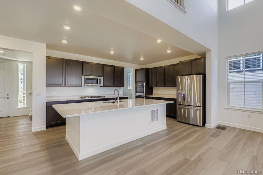 Furnished interior view inside a new home in Sunset Village: The Grand Collection, Erie (Image 4).