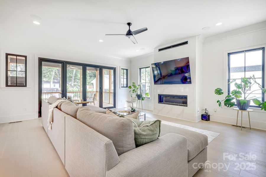 Generous family room with folding doors to screened porch