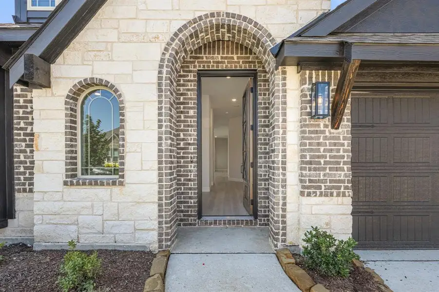 Front exterior of a new home in Maplewood, Glenn Heights, TX, highlighting curb appeal (Image 2).