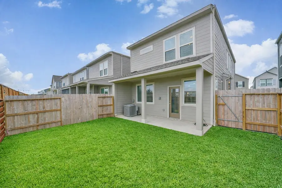 The home enjoys this pleasant outside lawn and covered patio. The home enjoys this pleasant outside lawn and covered patio.