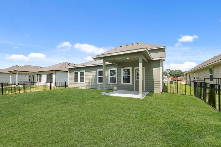 Front exterior of a new home in Lakes at Crockett Martin, Conroe, TX, highlighting curb appeal (Image 17).