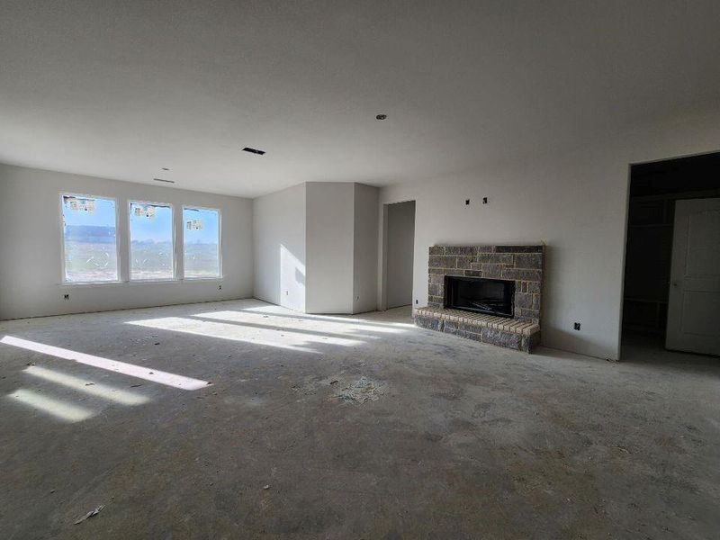 Unfurnished living room featuring a fireplace