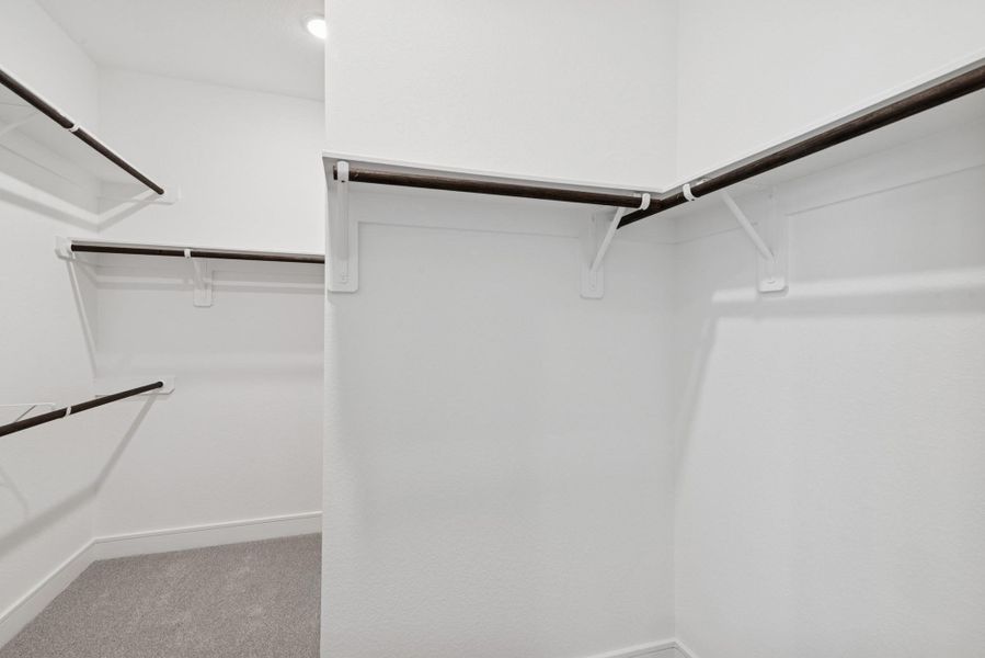 Primary walk-in closet Primary walk-in closet