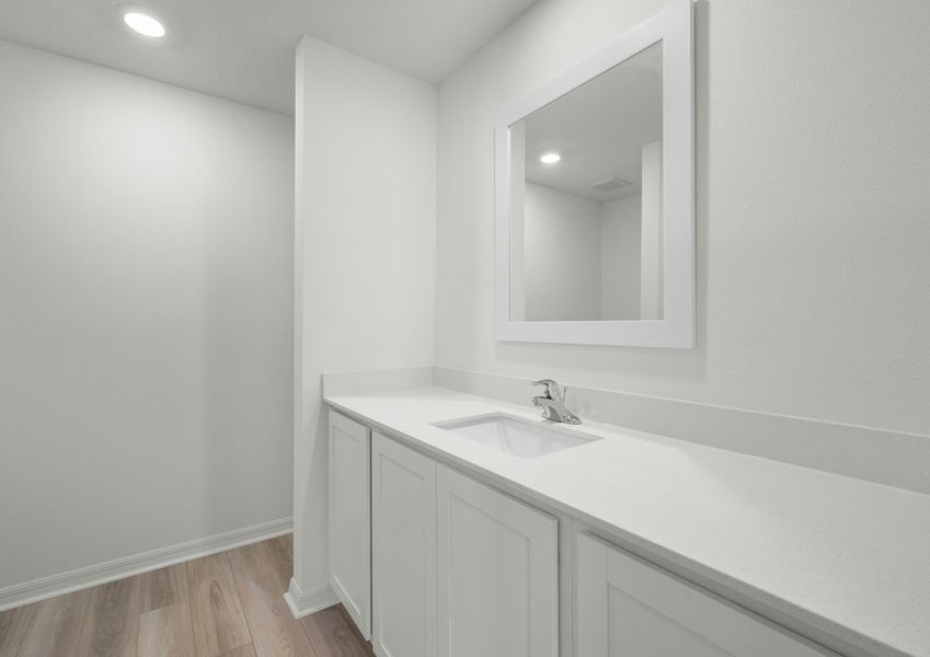 Storage and a large vanity in the master bathroom