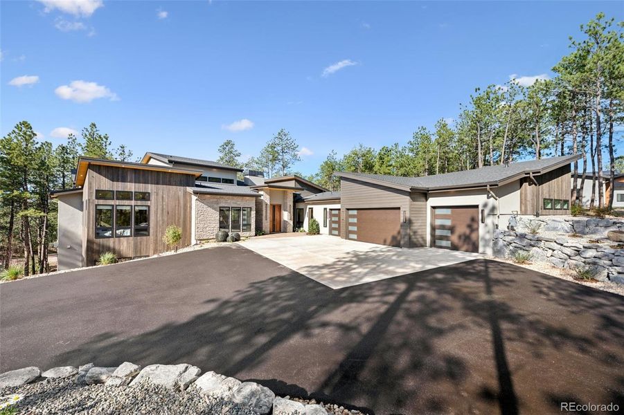 Front exterior of a new home in , Monument, CO, highlighting curb appeal (Image 1).
